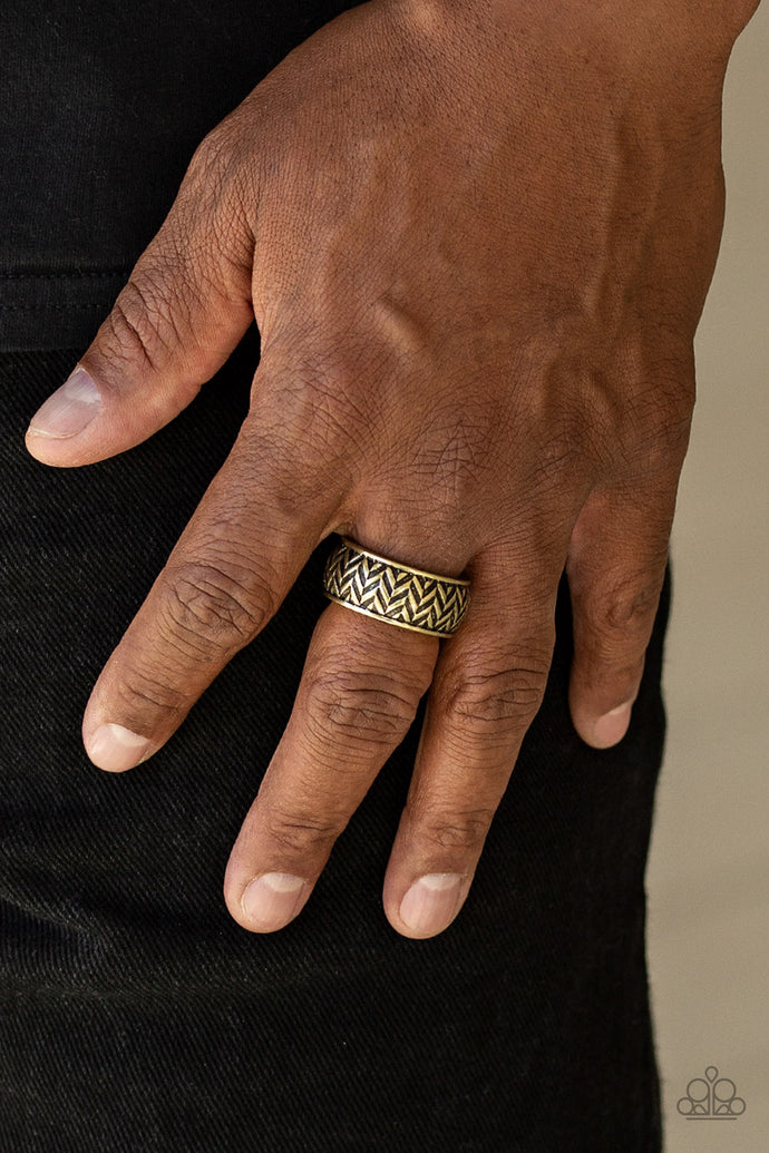Brushed in an antiqued finish, stacked rows of chevron-like patterns are etched and embossed across a thick brass band for a tactile look. Features a stretchy band for a flexible fit.   Sold as one individual ring.  