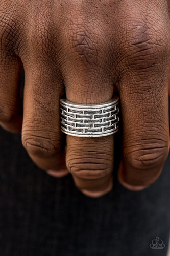 Brushed in an antiqued finish, abstract bar-like patterns are stamped across the front of a thick silver band for a casual look. Features a stretchy band for a flexible fit.  Sold as one individual ring.  Always nickel and lead free.