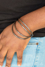 Load image into Gallery viewer, Glistening gunmetal bars arc across the wrist, coalescing into an airy cuff.  Sold as one individual bracelet.  Always nickel and lead free. 
