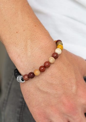  Infused with dainty silver accents, a collection of black lava rock beads and refreshing stone beads are threaded along a stretchy band around the wrist for a seasonal style.  Sold as one individual bracelet.