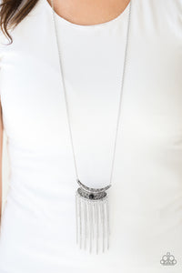 Embossed in vine-like patterns, a stacked silver pendant gives way to a shimmery silver fringe. Infused with an elongated silver chain, a dainty black bead is pressed into the center of the antiqued pendant for a colorful finish. Features an adjustable clasp closure.  Sold as one individual necklace. Includes one pair of matching earrings.  Always nickel and lead free.