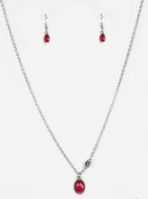 Load image into Gallery viewer, A faceted red bead swings from the bottom of a shimmery silver chain. A smoky rhinestone adorns one side for a sleek asymmetrical finish. Features an adjustable clasp closure.  Sold as one individual necklace. Includes one pair of matching earrings.