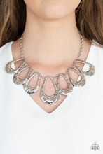 Load image into Gallery viewer, Delicately hammered in shimmer, a collection of shiny silver teardrops link below the collar for an edgy statement-making look. Features an adjustable clasp closure.  Sold as one individual necklace. Includes one pair of matching earrings.  Always nickel and lead free