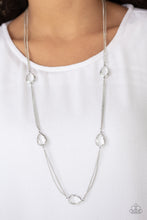 Load image into Gallery viewer, Glassy white teardrops attach to sections of silver chain across the chest, creating a refined display. Features an adjustable clasp closure.  Sold as one individual necklace. Includes one pair of matching earrings.  Always nickel and lead free.