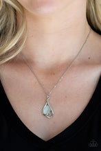 Load image into Gallery viewer, Shimmery silver bars curl around a white teardrop moonstone, creating an elegant heart shaped pendant below the collar. Features an adjustable clasp closure.  Sold as one individual necklace. Includes one pair of matching earrings.  Always nickel and lead free.
