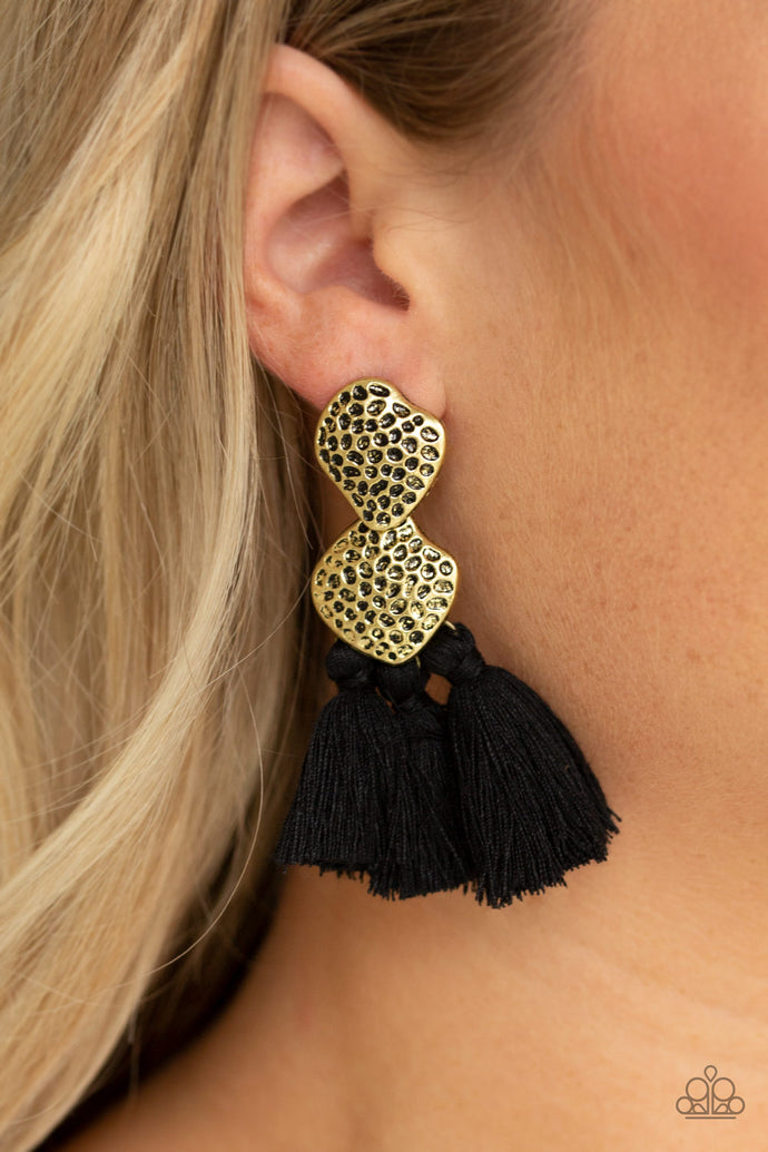 Delicately hammered in glistening textures, two asymmetrical brass frames link into an abstract lure. Three black threaded tassels swing from the bottom of the rustic frame for a trendy finish. Earring attaches to a standard post fitting.  Sold as one pair of post earrings.  Always nickel and lead free.