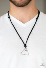 Load image into Gallery viewer, A hammered triangle and textured silver disc featuring a stenciled tree pattern are knotted in place at the bottom of black leather strands for a seasonal look. Features an adjustable sliding knot closure.  Sold as one individual necklace.  