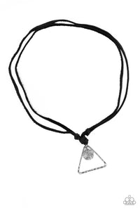 A hammered triangle and textured silver disc featuring a stenciled tree pattern are knotted in place at the bottom of black leather strands for a seasonal look. Features an adjustable sliding knot closure. Sold as one individual necklace.