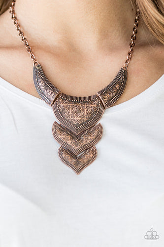 Stamped in whimsical floral patterns, studded copper plates link below the collar for a fierce look. Features an adjustable clasp closure.  Sold as one individual necklace. Includes one pair of matching earrings.  Always nickel and lead free.