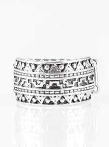 Brushed in an antiqued shimmer, a glistening silver band is embossed in stunning textile patterns for a seasonal look. Features a stretchy band for a flexible fit.  Sold as one individual ring.