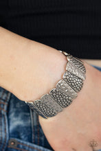 Load image into Gallery viewer, Hammered and embossed in antiqued patterns, asymmetrical silver frames are threaded along stretchy bands around the list for seasonal look.  Sold as one individual bracelet.  Always nickel and lead free.
