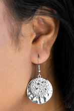 Load image into Gallery viewer, Embossed in a metallic rock-like pattern, a glistening silver disc attaches to a larger hammered silver frame for a seasonal look. Earring attaches to standard fishhook fitting.  Sold as one pair of earrings.  Always nickel and lead free. 