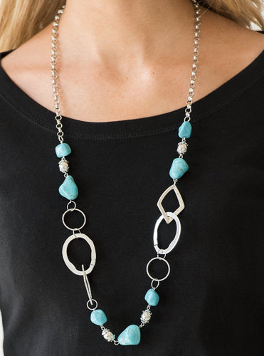 Bits of refreshing turquoise stones and ornate silver beading give way to asymmetrical silver frames. The mismatched frames drape across the chest, creating an earthy collision of rock and metal. Features an adjustable clasp closure.  Sold as one individual necklace. Includes one pair of matching earrings.  