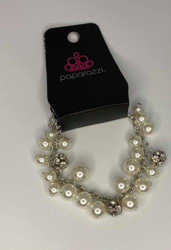 Infused with clusters of dainty white pearls linking around the wrist, creating a bubbly fringe. Features an adjustable clasp closure.  Sold as one individual bracelet.   Always nickel and lead free.  Fashion Fix February 2021 Exclusive