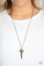 Load image into Gallery viewer, A mismatched pair of brass keys swing from the bottom of a shimmery brass chain, creating an edgy pendant. Features an adjustable clasp closure.  Sold as one individual necklace. Includes one pair of matching earrings.  Always nickel and lead free.