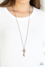 Load image into Gallery viewer, Brushed in an antiqued finish, dainty brass keys swing from the bottom of an elongated brass chain in a vintage inspired fashion. Features an adjustable clasp closure.  Sold as one individual necklace. Includes one pair of matching earrings.  Always nickel and lead free.