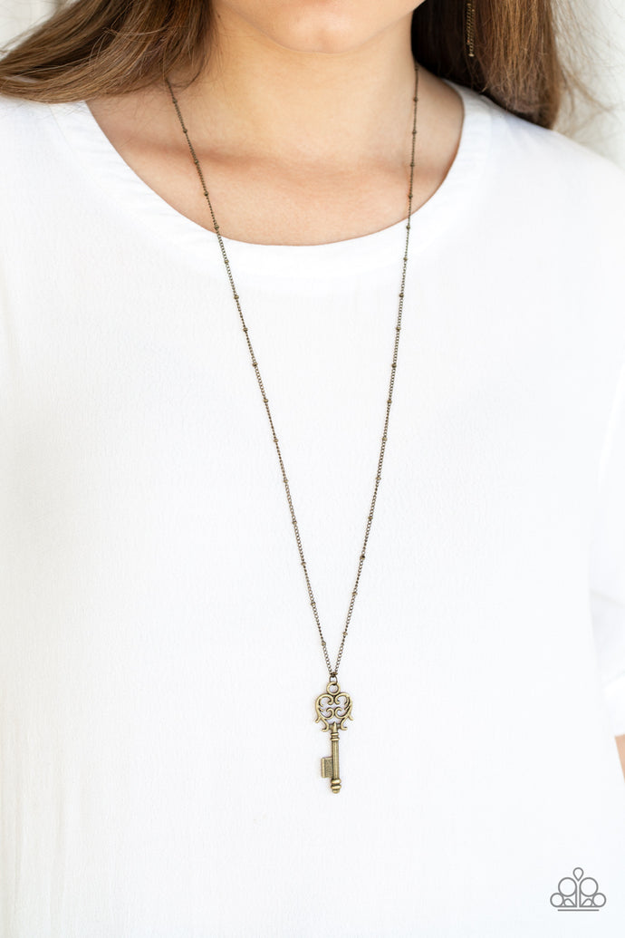 Brushed in an antiqued finish, dainty brass keys swing from the bottom of an elongated brass chain in a vintage inspired fashion. Features an adjustable clasp closure.  Sold as one individual necklace. Includes one pair of matching earrings.  Always nickel and lead free.
