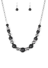 Load image into Gallery viewer, Necklace and Earrings:  A collection of faux black stones, shiny silver beads, and white rhinestone encrusted rings join below the collar in a refined fashion. Features an adjustable clasp closure.  Bracelet:  Faux black stones, shiny silver beads, and white rhinestone encrusted rings are threaded along a stretchy band and wrapped around the wrist for a refined look.