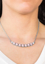 Load image into Gallery viewer, A row of pearly pink beading is pressed into a slightly bowing frame, creating a refined pendant below the collar. Two glittery white rhinestones are pressed into the classy pendant for a timeless finish. Features an adjustable clasp closure.  Sold as one individual necklace. Includes one pair of matching earrings.