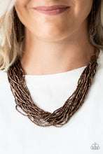 Load image into Gallery viewer, Strands of copper seed beads subtlety twist below the collar, coalescing into a blinding shimmer. Features an adjustable clasp closure.  Sold as one individual necklace. Includes one pair of matching earrings.  Always nickel and lead free.