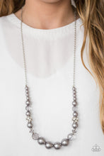 Load image into Gallery viewer, Pearly silver and glittery white crystal-like beads are threaded along the bottom of an elongated silver chain. The beads decrease in size as they climb the chain, while sparkling accents are sprinkled between them for a glamorous finish. Features an adjustable clasp closure.  Sold as one individual necklace. Includes one pair of matching earrings.  