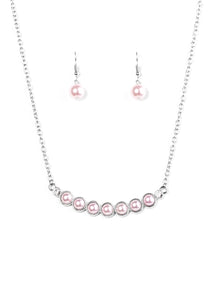 A row of pearly pink beading is pressed into a slightly bowing frame, creating a refined pendant below the collar. Two glittery white rhinestones are pressed into the classy pendant for a timeless finish. Features an adjustable clasp closure.  Sold as one individual necklace. Includes one pair of matching earrings.