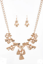 Load image into Gallery viewer, Twisted gold hourglasses dance along a chunky gold chain with tiny peach rhinestones adding sparkling, elegant accents. Beautiful textured pieces add depth to the design. Features an adjustable clasp closure.  Sold as one individual necklace. Includes one pair of matching earrings.