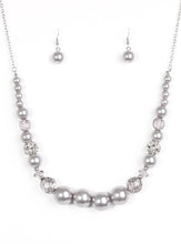 Load image into Gallery viewer, Pearly silver and glittery white crystal-like beads are threaded along the bottom of an elongated silver chain. The beads decrease in size as they climb the chain, while sparkling accents are sprinkled between them for a glamorous finish. Features an adjustable clasp closure.  Sold as one individual necklace. Includes one pair of matching earrings.