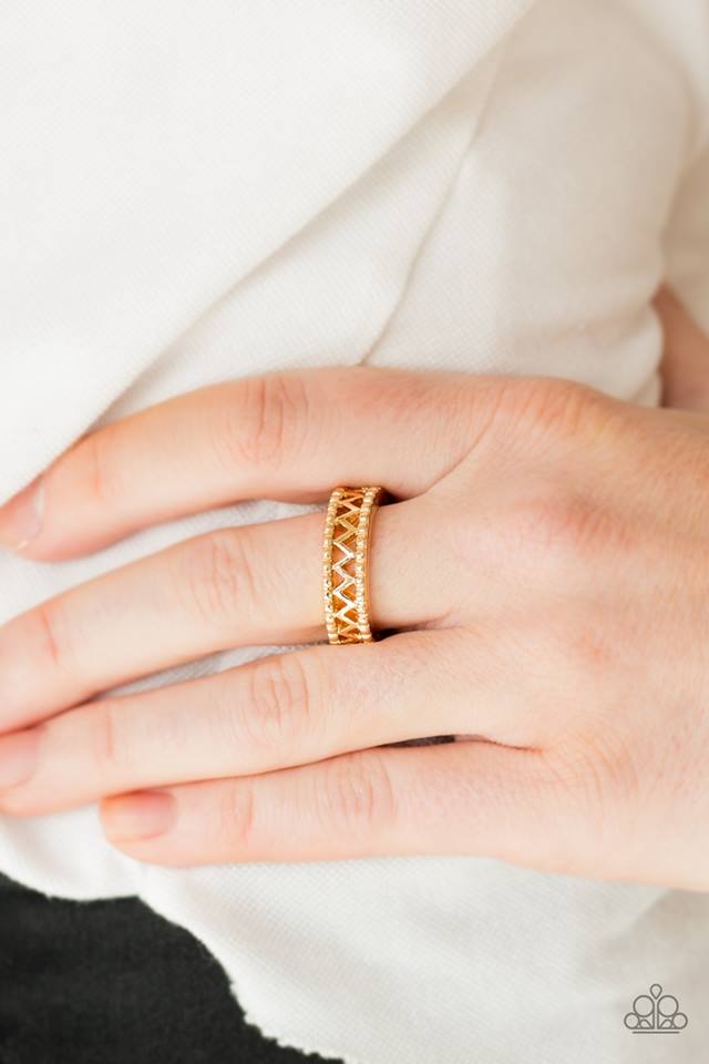 A shimmery gold bar zigzags down the center of a studded band for a tribal inspired look. Features a dainty stretchy band for a flexible fit.  Sold as one individual ring.  Always nickel and lead free.