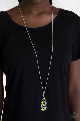 Brushed in a vivacious green finish, a bubbly silver teardrop swings from the bottom of an elongated silver chain for a tribal inspired look. Features an adjustable clasp closure.  Sold as one individual necklace. Includes one pair of matching earrings.  Always nickel and lead free.