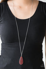 Load image into Gallery viewer, Brushed in a vivacious red finish, a bubbly silver teardrop swings from the bottom of an elongated silver chain for a tribal inspired look. Features an adjustable clasp closure.  Sold as one individual necklace. Includes one pair of matching earrings.  Always nickel and lead free.