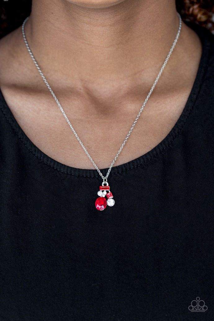 Varying in shape and size, glittery red and white rhinestones coalesce into a sparkling pendant below the collar for a timeless look. Features an adjustable clasp closure.  Sold as one individual necklace. Includes one pair of matching earrings.
