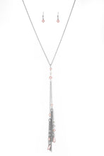 Load image into Gallery viewer, Dainty pink pearls and sparkling white crystal-like bead gives way to two shimmery silver chain tassels. Infused with ornate silver beads, strands of matching beads trickle down the tassels for a refined flair. Features an adjustable clasp closure.  Sold as one individual necklace. Includes one pair of matching earrings.