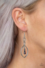 Load image into Gallery viewer, A glistening silver ribbon twists into an elegant lure. Gradually increasing in size, a trio of glassy purple rhinestones swing from the top of the frame for a dazzling finish. Earring attaches to a standard fishhook fitting.  Sold as one pair of earrings.  Always nickel and lead free.