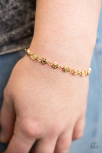 Brushed in a high-sheen shimmer, dainty gold frames stamped in whimsical hearts link across the wrist in a feminine fashion. Features an adjustable clasp closure.  Sold as one individual bracelet.   Always nickel and lead free.