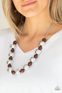 Polished brown beads and dramatic silver beads drape below the collar for a perfect pop of color. Features an adjustable clasp closure.  Sold as one individual necklace. Includes one pair of matching earrings.  Always nickel and lead free.