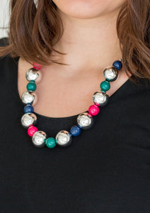 Polished multicolored beads and dramatic silver beads drape below the collar for a perfect pop of color. Features an adjustable clasp closure.  Sold as one individual necklace. Includes one pair of matching earrings.