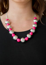 Load image into Gallery viewer, Polished pink beads and dramatic silver beads drape below the collar for a perfect pop of color. Features an adjustable clasp closure.  Sold as one individual necklace. Includes one pair of matching earrings. 