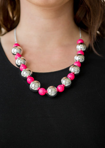 Polished pink beads and dramatic silver beads drape below the collar for a perfect pop of color. Features an adjustable clasp closure.  Sold as one individual necklace. Includes one pair of matching earrings. 