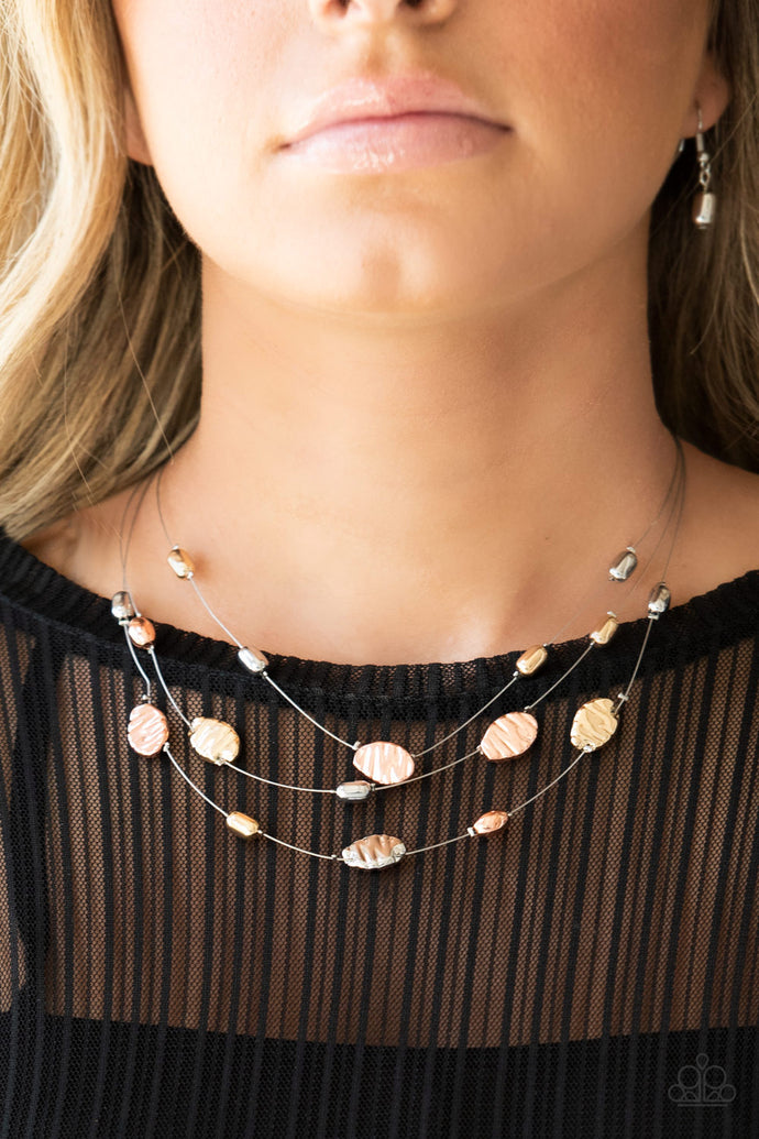 Featuring smooth and delicately hammered finishes, mismatched shiny copper, gold, and silver beads are threaded along dainty silver wire, creating floating layers below the collar. Features an adjustable clasp closure.  Sold as one individual necklace. Includes one pair of matching earrings.  Always nickel and lead free.
