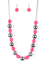 Load image into Gallery viewer, Polished pink beads and dramatic silver beads drape below the collar for a perfect pop of color. Features an adjustable clasp closure.  Sold as one individual necklace. Includes one pair of matching earrings.