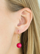 Load image into Gallery viewer, Varying in shape, glassy and polished pink beads swing from the bottom of interlocking gold chains. Crystal-like teardrops are sprinkled along the colorful beading, creating a flirtatious fringe below the collar. Features an adjustable clasp closure.  Sold as one individual necklace. Includes one pair of matching earrin
