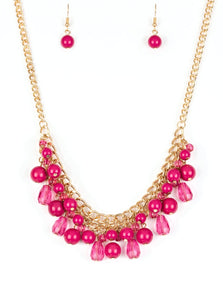 Varying in shape, glassy and polished pink beads swing from the bottom of interlocking gold chains. Crystal-like teardrops are sprinkled along the colorful beading, creating a flirtatious fringe below the collar. Features an adjustable clasp closure.  Sold as one individual necklace. Includes one pair of matching earrin