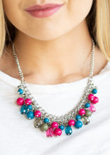 Load image into Gallery viewer, Varying in shape, glassy and polished blue, green, and pink beads swing from the bottom of interlocking silver chains. Crystal-like teardrops are sprinkled along the colorful beading, creating a flirtatious fringe below the collar. Features an adjustable clasp closure.  Sold as one individual necklace. Includes one pair of matching earrings. 