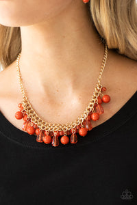 Varying in shape, glassy and polished orange beads swing from the bottom of interlocking gold chains. Crystal-like teardrops are sprinkled along the colorful beading, creating a flirtatious fringe below the collar. Features an adjustable clasp closure.  Sold as one individual necklace. Includes one pair of matching earrings.  Always nickel and lead free.