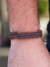 Load image into Gallery viewer, Shiny brown cords knot around three brown leather strands, securing the bands in place across the wrist for a rugged look. Features an adjustable sliding knot closure.  Sold as one individual bracelet.