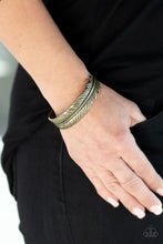 Load image into Gallery viewer, Brushed in an antiqued shimmer, a lifelike brass feather wraps around the wrist, creating a seasonal cuff.  Sold as one individual bracelet.  Always nickel and lead free.