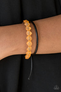Featuring an opaque finish, a strand of faceted orange beads and a strand of shiny leather cording wrap around the wrist, creating dainty layers. Features an adjustable sliding knot closure.  Sold as one individual bracelet.  Always nickel and lead free.