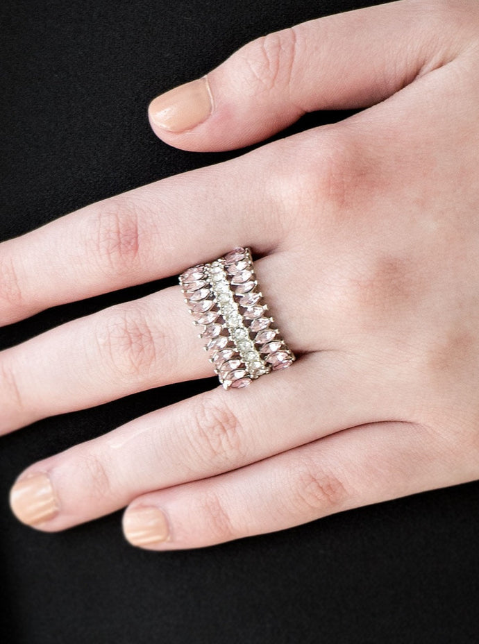 Featuring refined marquise cuts, glittery pink rhinestones flare from a center of glassy white rhinestones, creating a regal band across the finger. Features a stretchy band for a flexible fit.  Sold as one individual ring.  