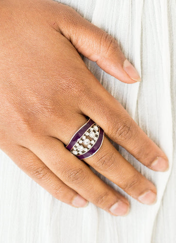 Glittery white rhinestones dance between two shiny purple bands, coalescing into a refined centerpiece. Features a stretchy band for a flexible fit.  Sold as one individual ring.  Always nickel and lead free!